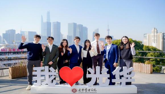 photo of students  in the PKU Future Leaders program standing in front of Chinese sign